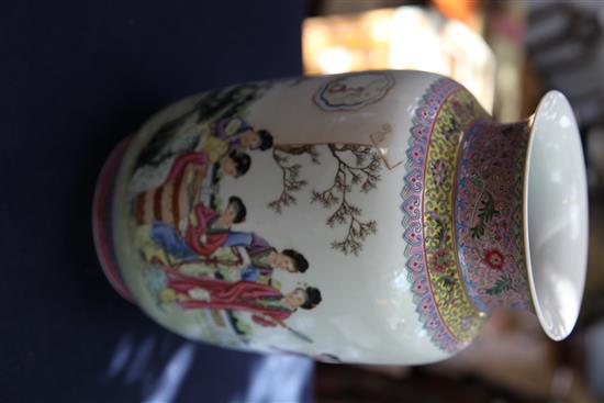 A pair of Chinese famille rose lantern shaped vases, height 29cm, wood stands